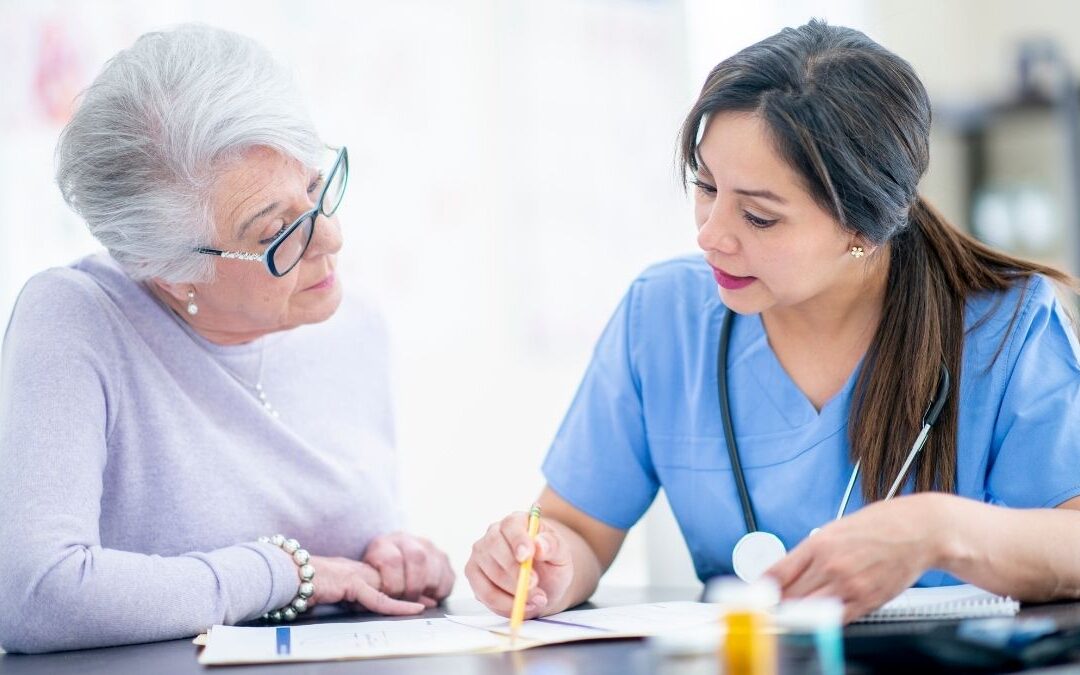 Healthcare professional explaining coverage options to a senior woman, representing AARP Medicare Supplement plans.